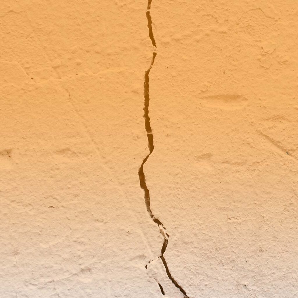 Fractured wall with a crack going down the middle
