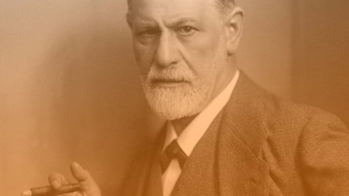 Sigmund Freud smoking cigar in portrait with orange hue