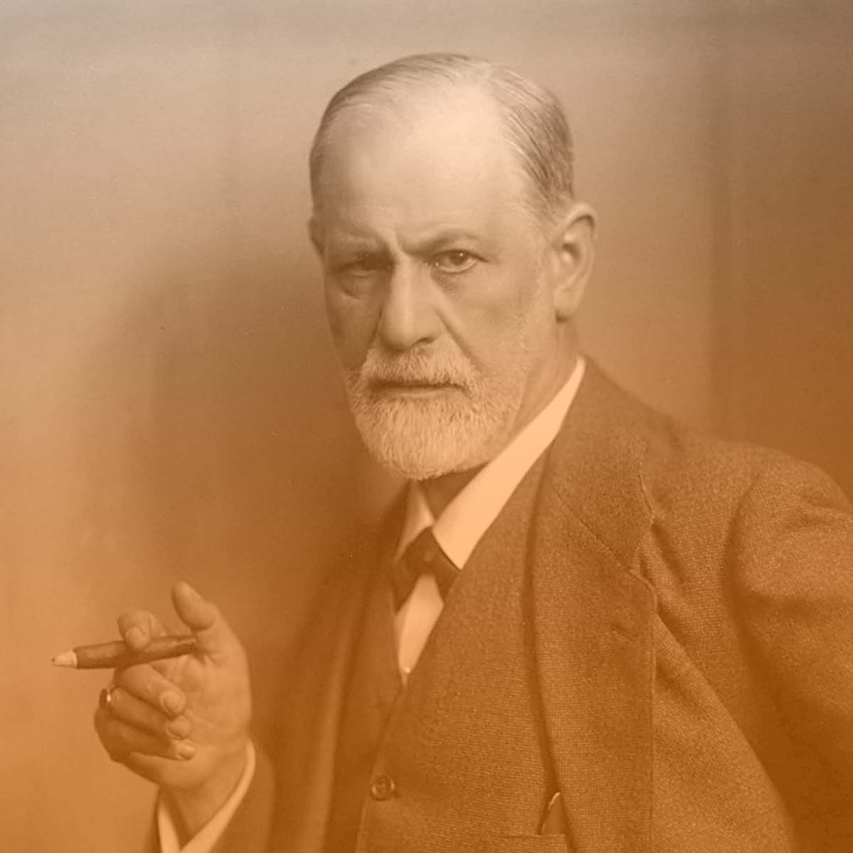 Sigmund Freud smoking cigar in portrait with orange hue